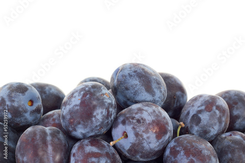 Delicious plums on white background