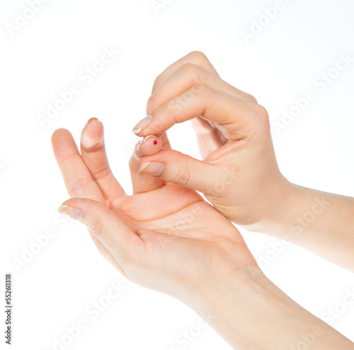 hand prick finger to make punctures to obtain small blood