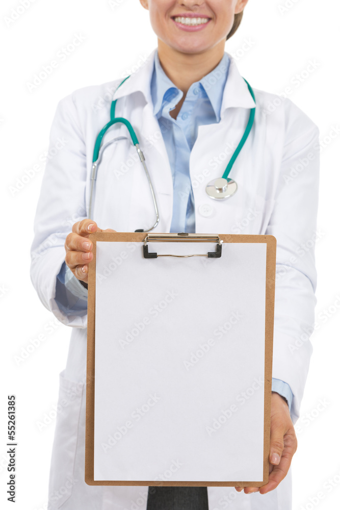 Closeup on doctor woman showing blank clipboard Closeup on doctor woman showing blank clipboard