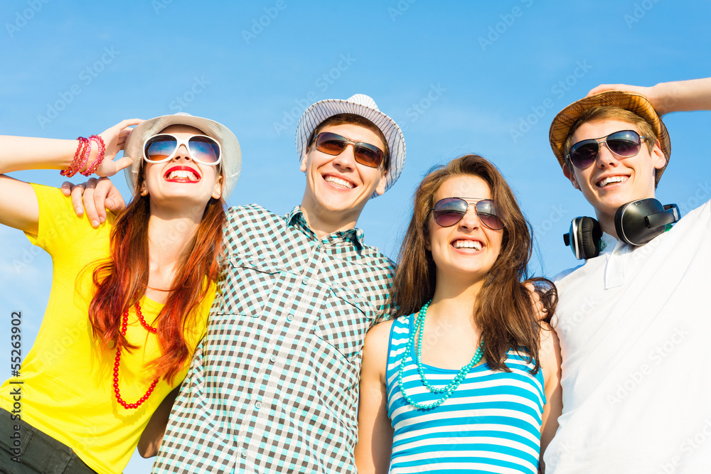 group of young people wearing sunglasses and hat group of young people wearing sunglasses and hat