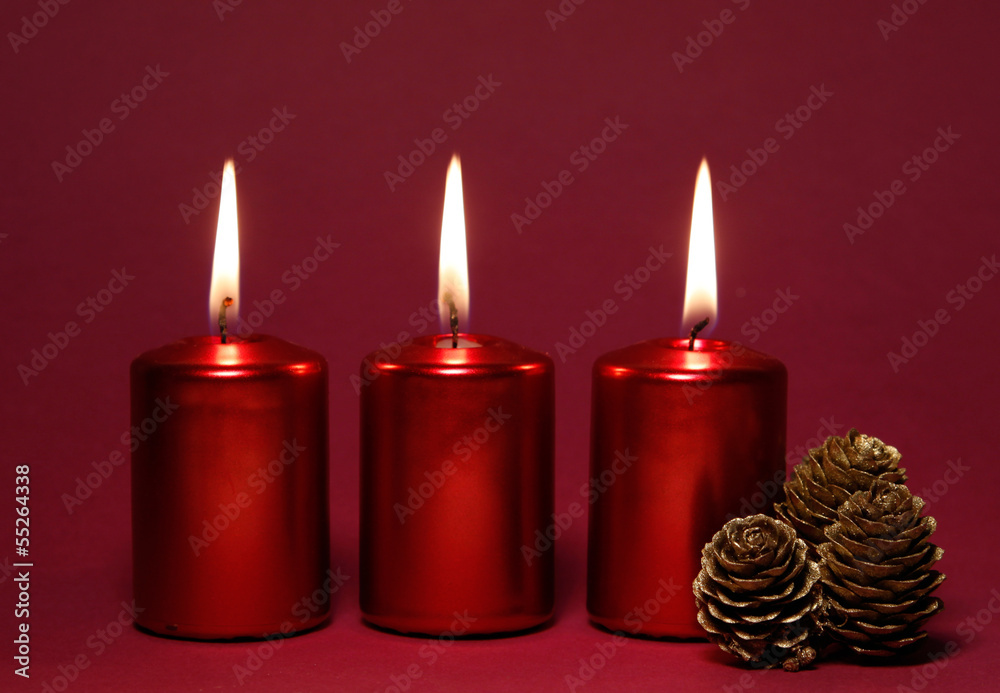 Three burning red candles