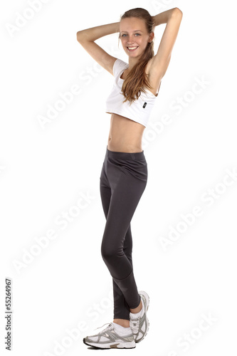 beautiful young girl doing aerobics - isolated on white