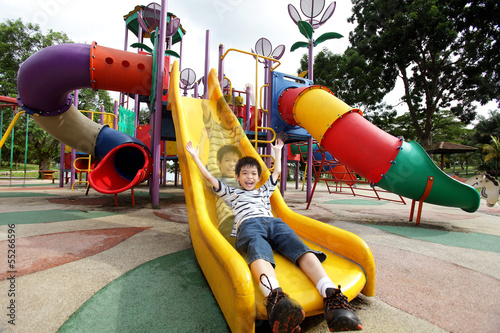 Happy boy sliding down