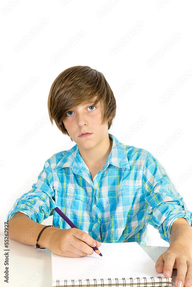 school boy working with a pencil, isolated on white school boy working with a pencil, isolated on white