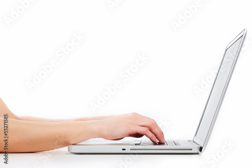 Hands with laptop computer.