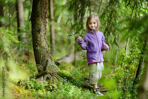 Adorable little girl hiking in the forest © MNStudio