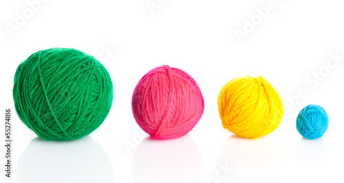 colorful different thread balls. wool knitting on white backgr