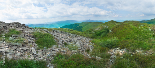 Beautiful green mountain panorama with blue sky above