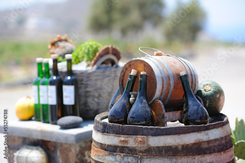 Still-life with wine bottles and barrels