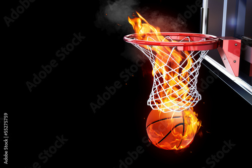 Flaming basketball going through a net © Digital Storm