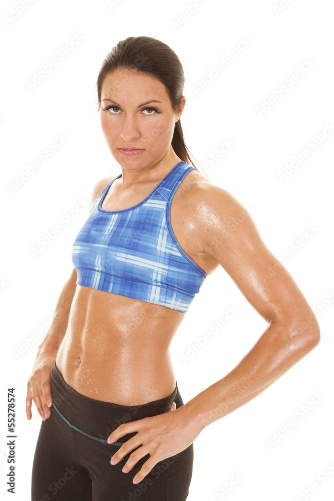 Woman blue plaid halter top sweat hands hips Woman blue plaid halter top sweat hands hips