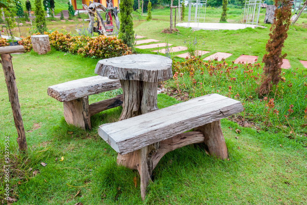 The empty wooden table and bench in garden or park The empty wooden table and bench in garden or park