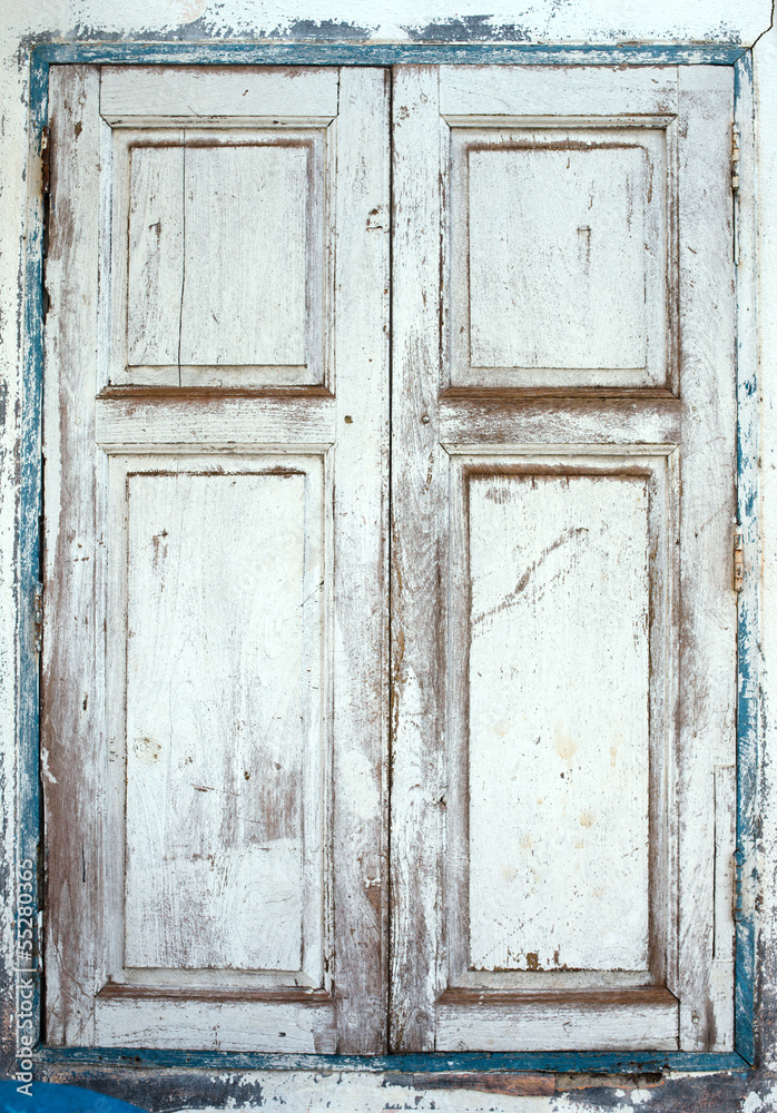 Wooden window shutters - Closed old shuttered weathered Wooden window shutters - Closed old shuttered weathered