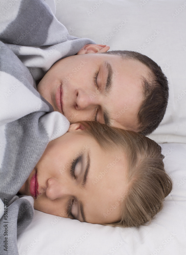 Closeup of a casual couple sleeping on the bed Closeup of a casual couple sleeping on the bed