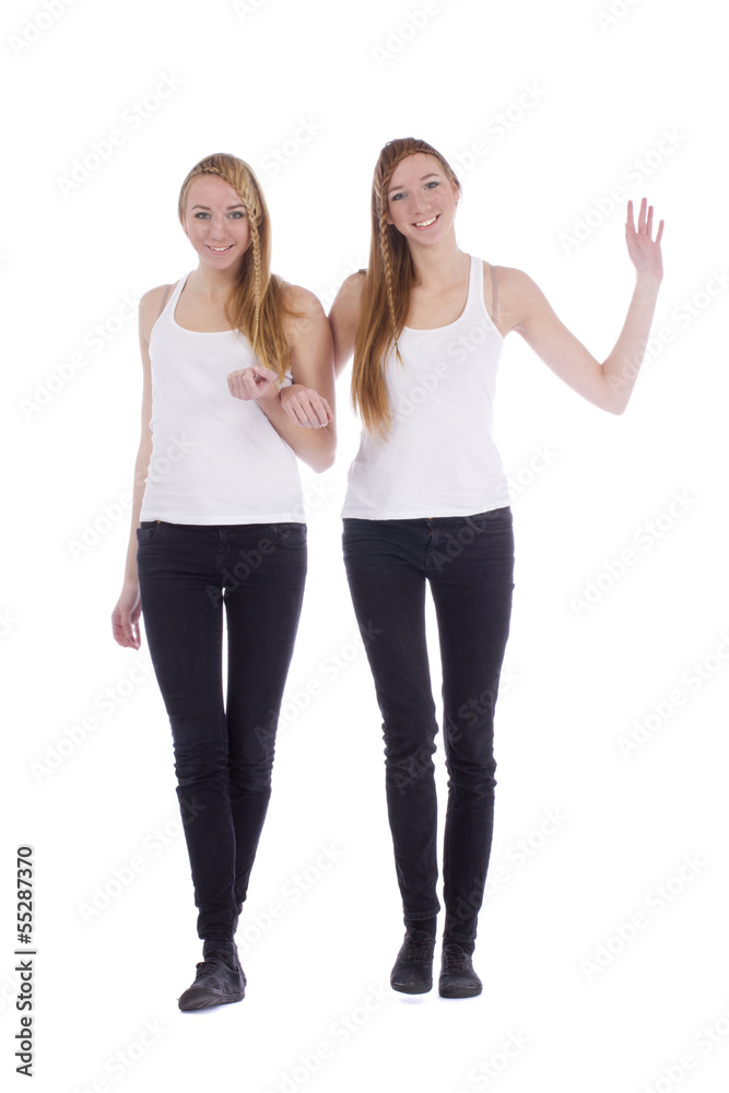 Two girls twins best friends concept isolated on white Two girls twins best friends concept isolated on white