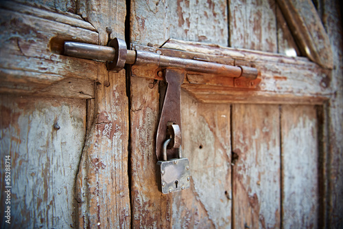 padlock with locking bar on doors © Kadmy