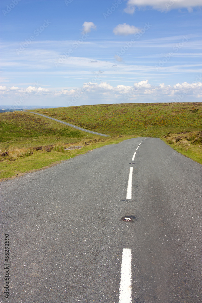 open road across dartmoor in the british countryside