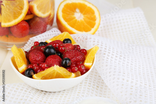 Useful fruit salad in glass cup and bowl