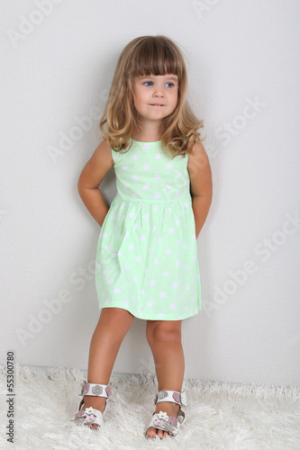 Little cute girl on carpet,...