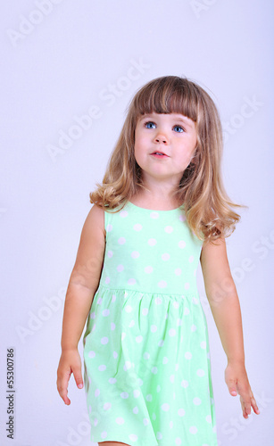 Little cute girl, on gray b...