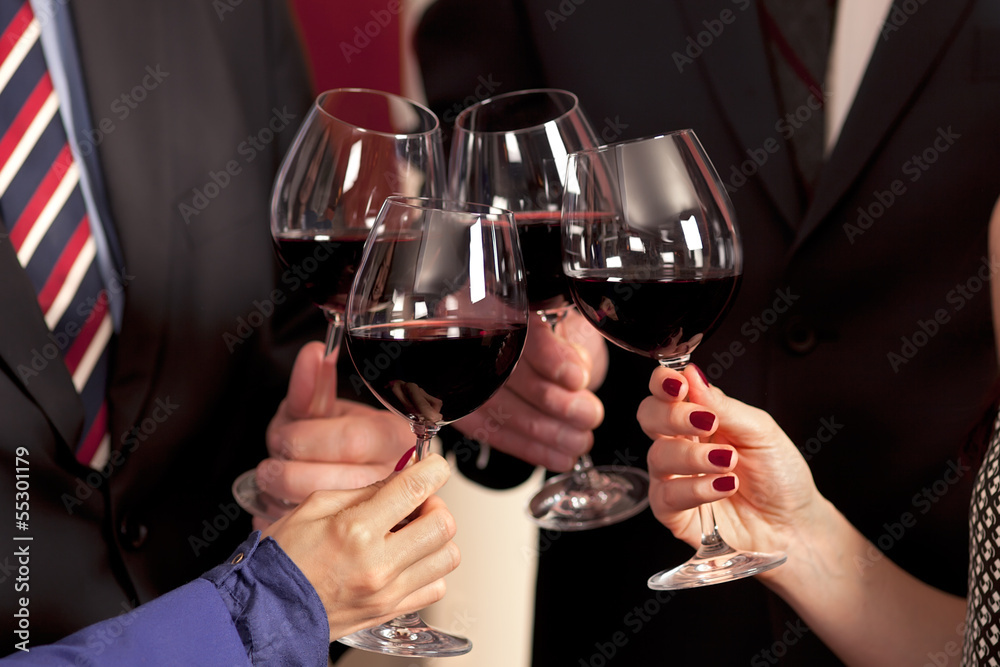 Clinking glasses with red wine. Clinking glasses with red wine.