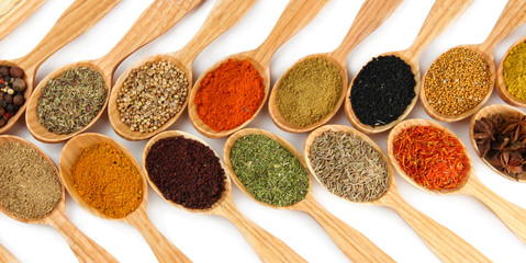 Acrylglasbilder Gewürze Assortment of spices in wooden spoons  © Africa Studio