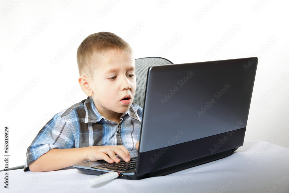 Computer addiction child with laptop notebook Computer addiction child with laptop notebook