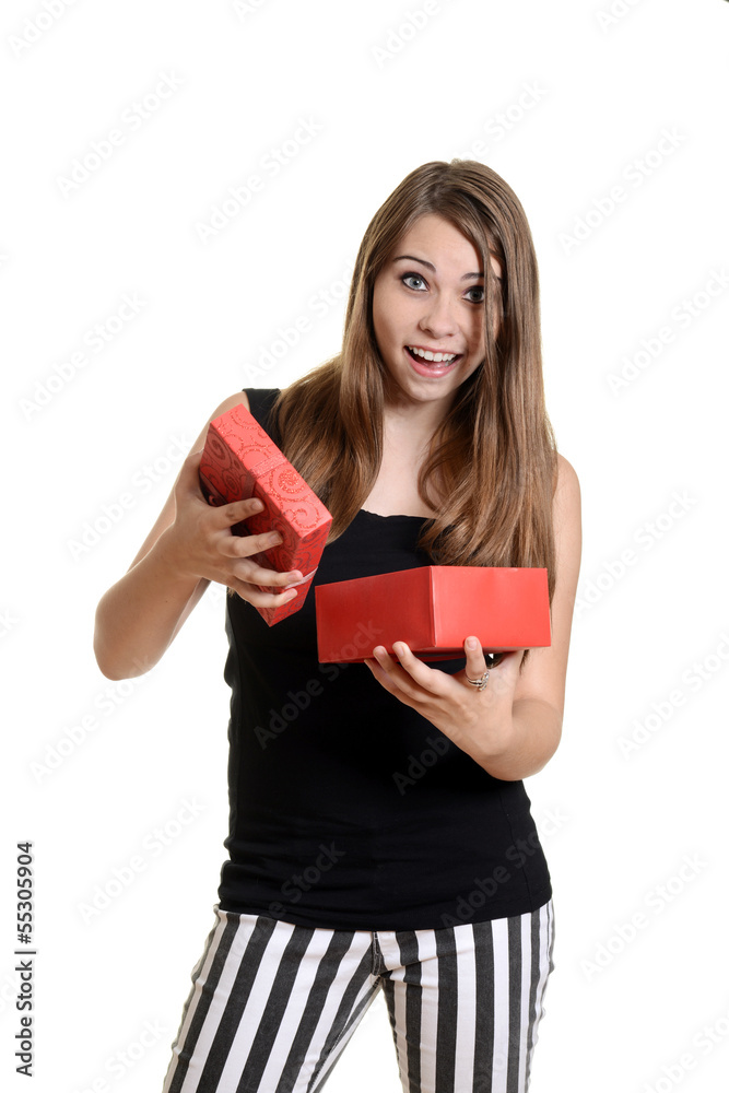 excited teen girl with christmas present excited teen girl with christmas present