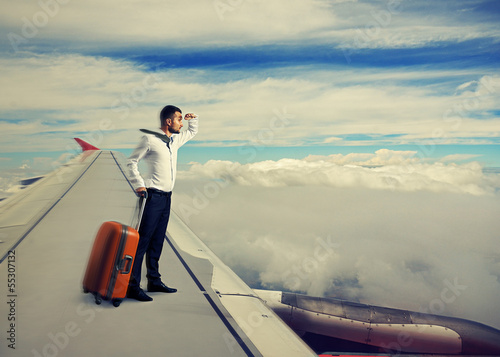 man standing on the wing photo