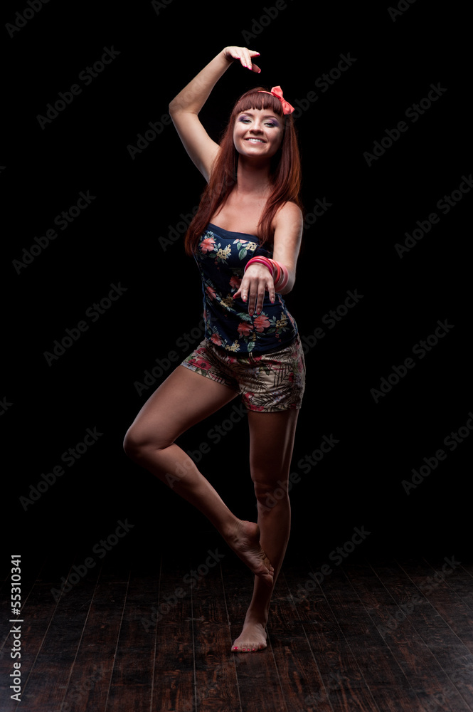 smiling female dancer showing move