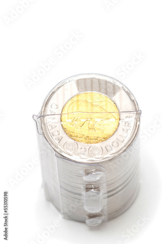 Plastic roll holding two dollar coins photo