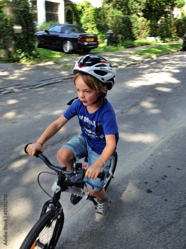 Naklejka premium young boy with bicycle and helmet