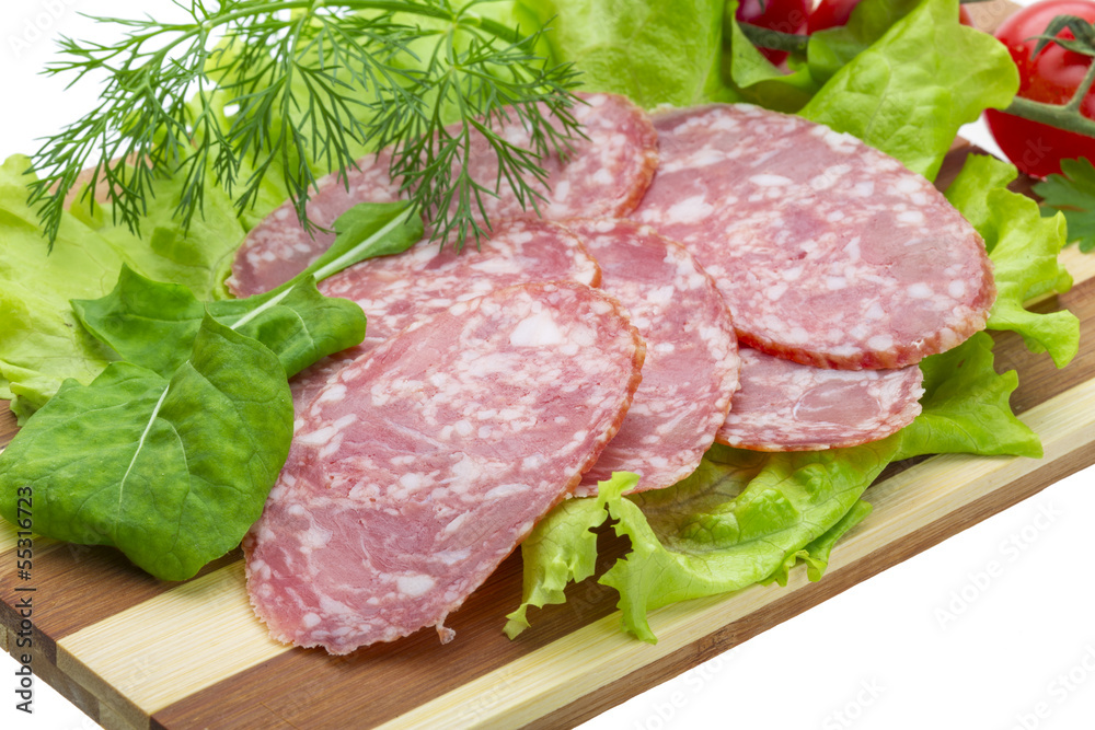 Sausages with salad and basil