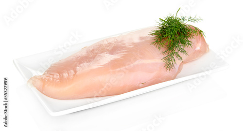 Raw chicken fillets on white plate, isolated on white