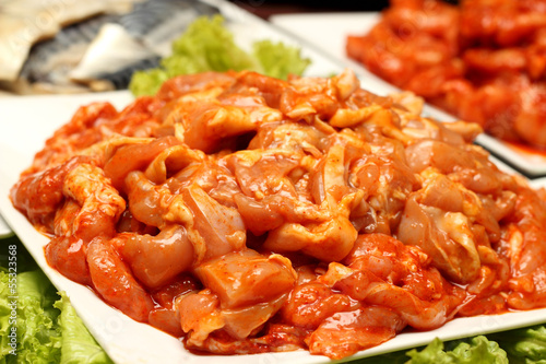 Raw marinated chicken