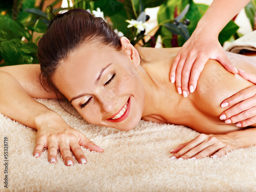 Woman getting  facial massage .