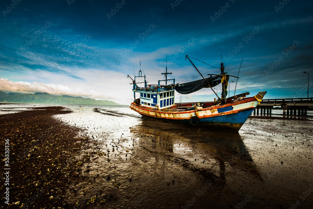Fishing boats on the beach mud