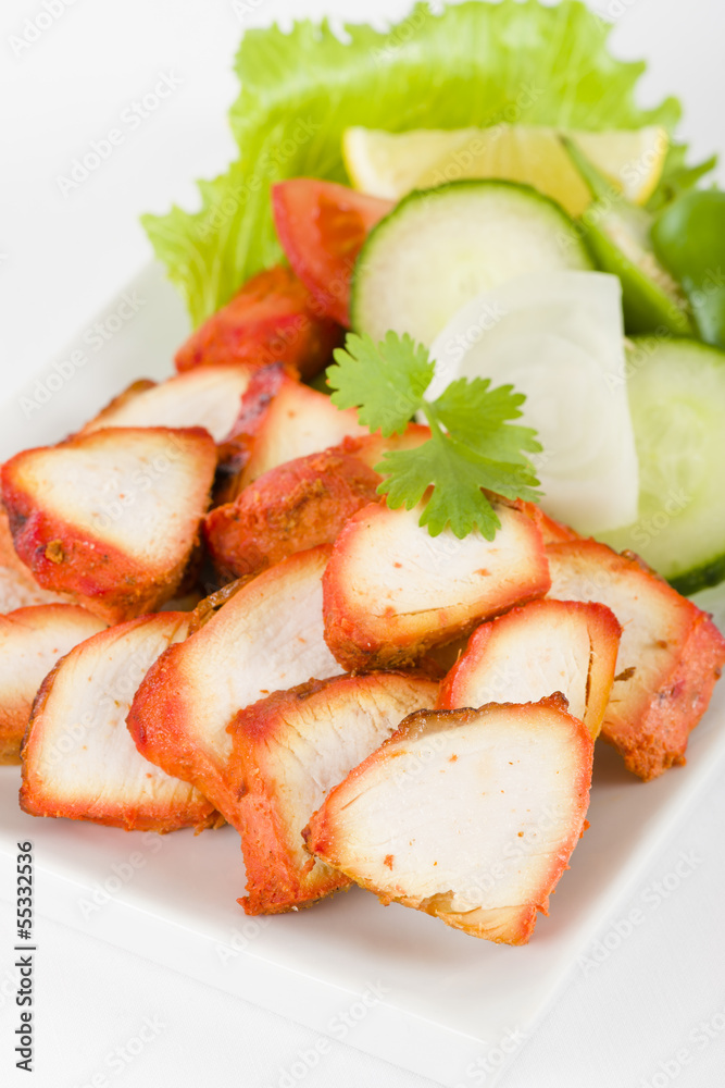 Chicken Tikka - Spicy marinated chicken served with salad Chicken Tikka - Spicy marinated chicken served with salad