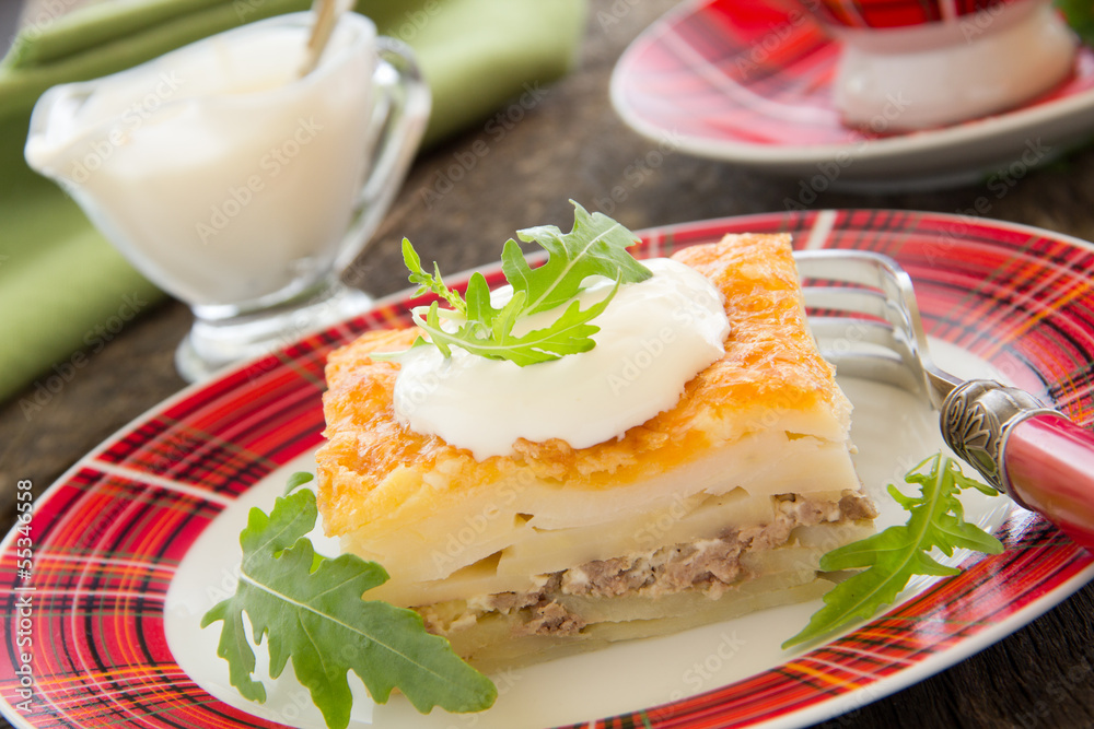 Potato gratin with cheese and meat.