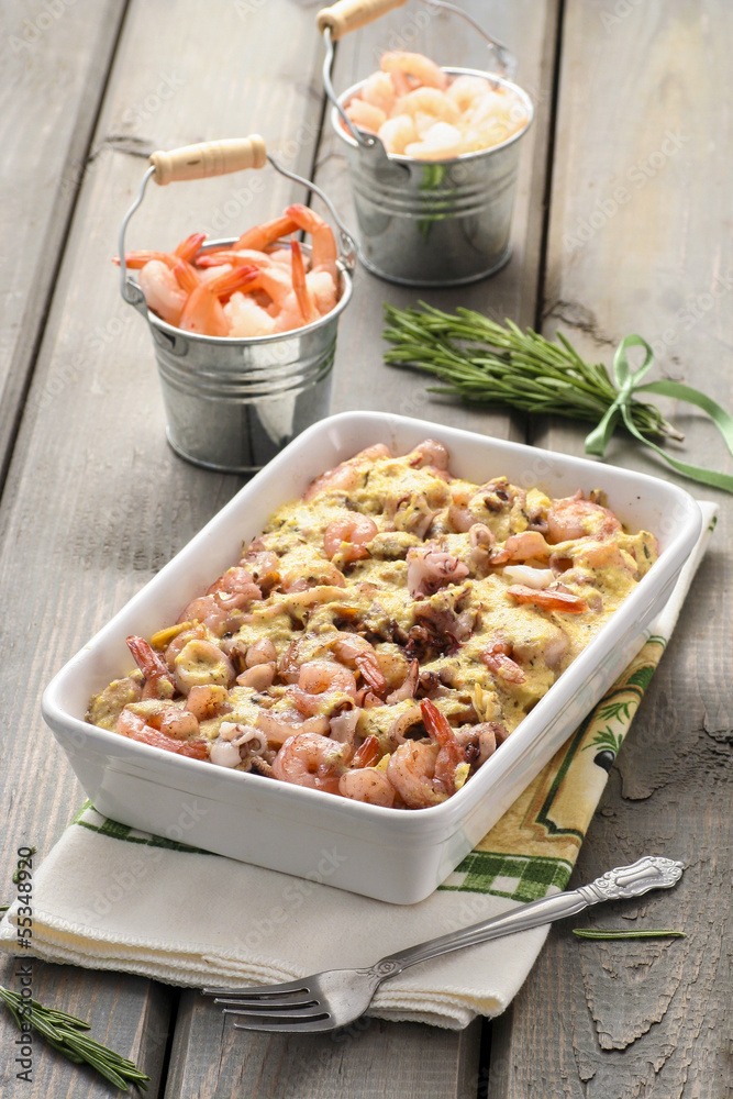 Pasta with seafood on rustic wooden table. Summer party food Pasta with seafood on rustic wooden table. Summer party food