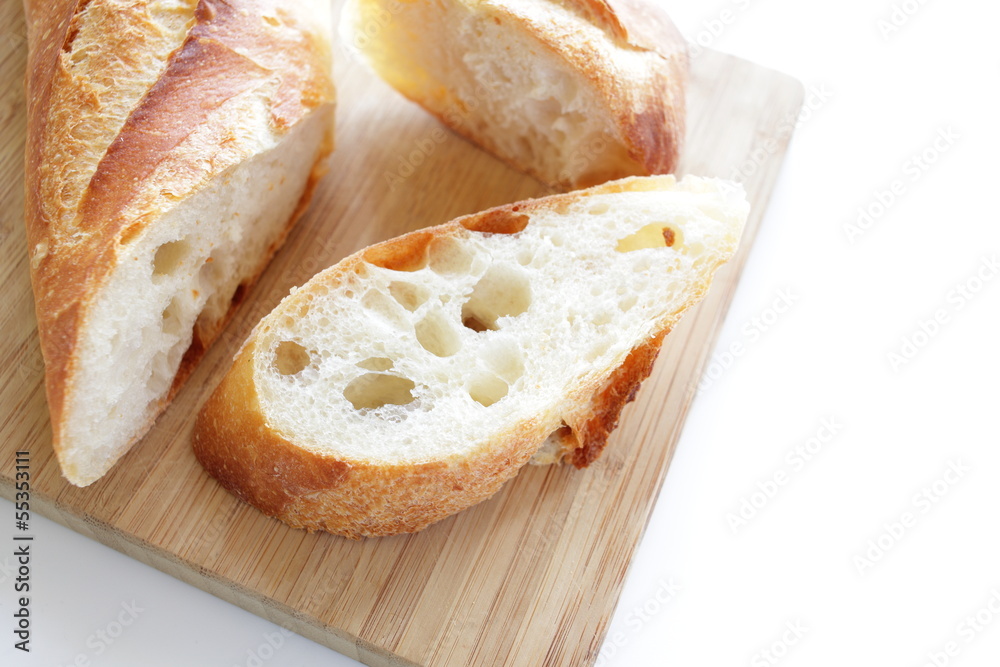 sliced baguette on wooden board, sliced baguette on wooden board,