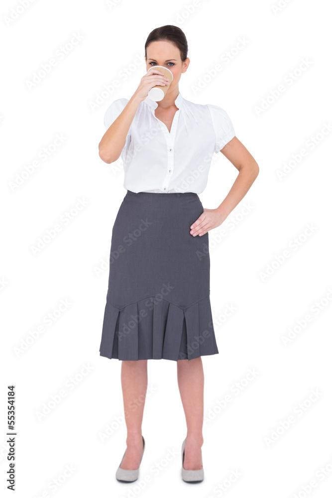 Pretty businesswoman drinking coffee Pretty businesswoman drinking coffee