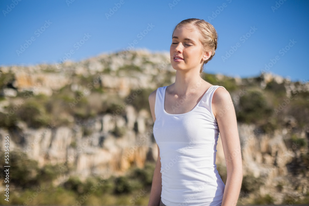 Woman with eyes closed enjoying the sun