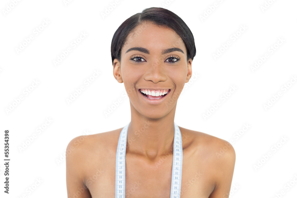 Pretty natural model with measuring tape on shoulders Pretty natural model with measuring tape on shoulders
