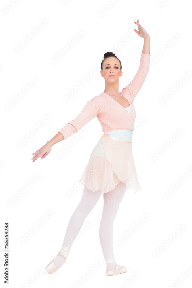 Calm attractive ballerina posing with an arm up Calm attractive ballerina posing with an arm up