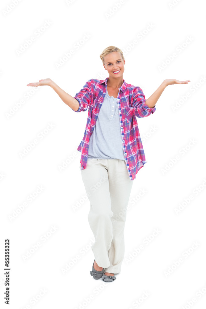 Blonde woman standing with arms open Blonde woman standing with arms open