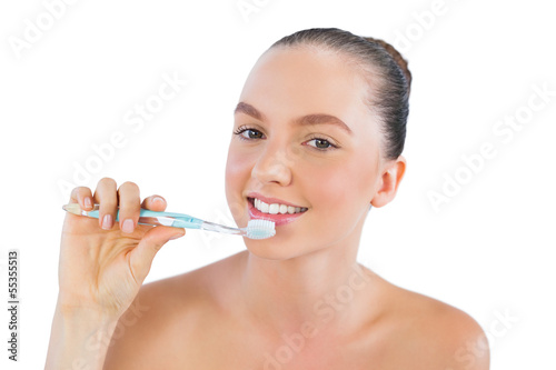Smiling woman with toothbrush