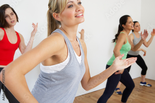 Group Of Women Exercising In Dance Studio #55359513