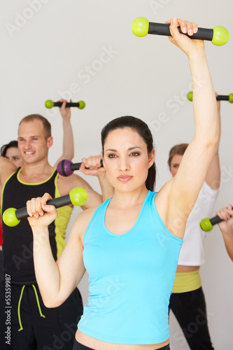 Group Of People Exercising In Dance Studio With Weights #55359987