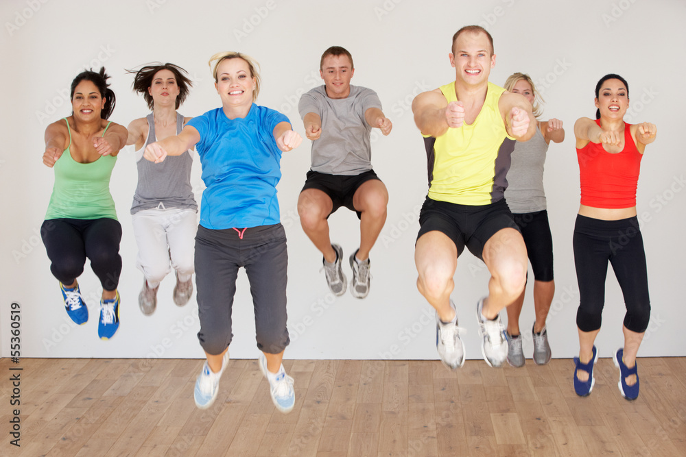 Fototapeta premium Group Of People Exercising In Dance Studio